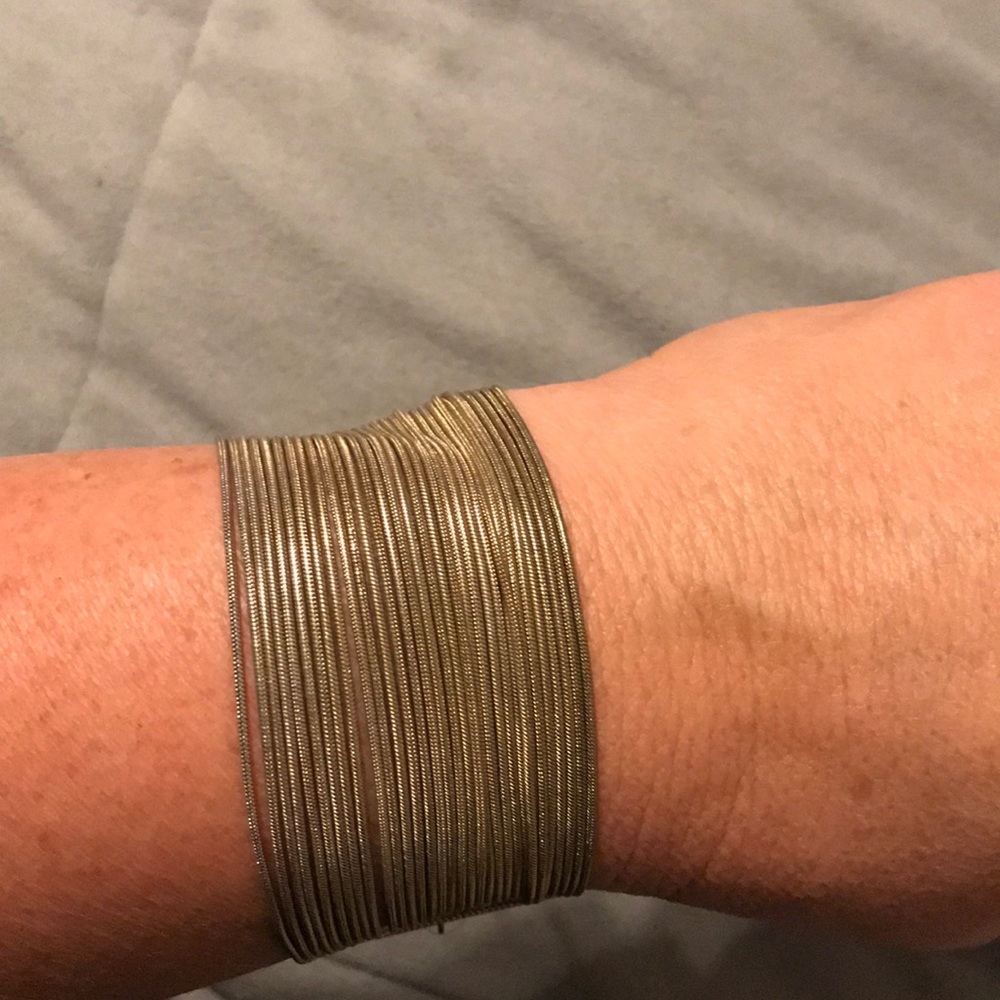 Gold tone multi strand bracelet